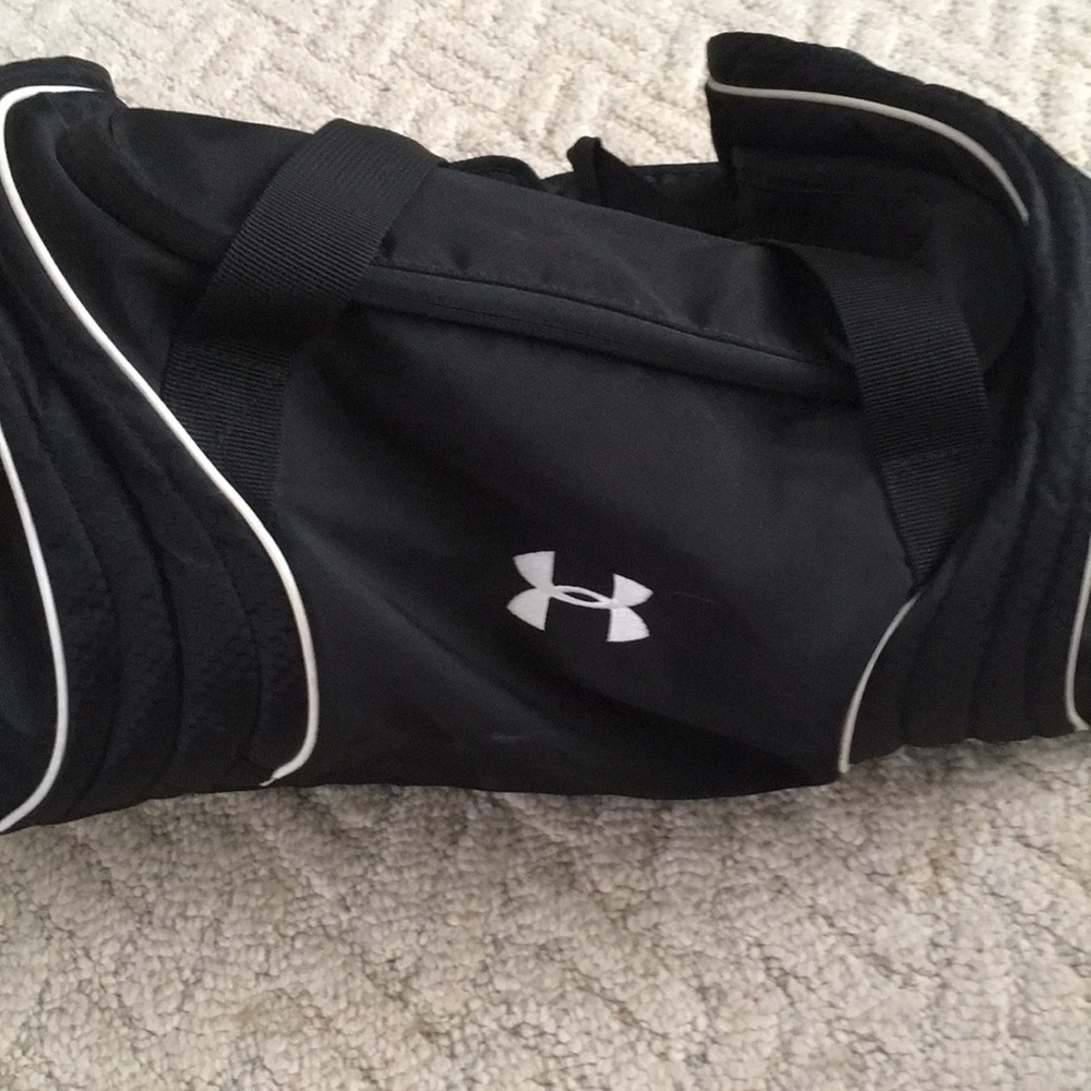Under Armor black gym bag with shoe compartment .